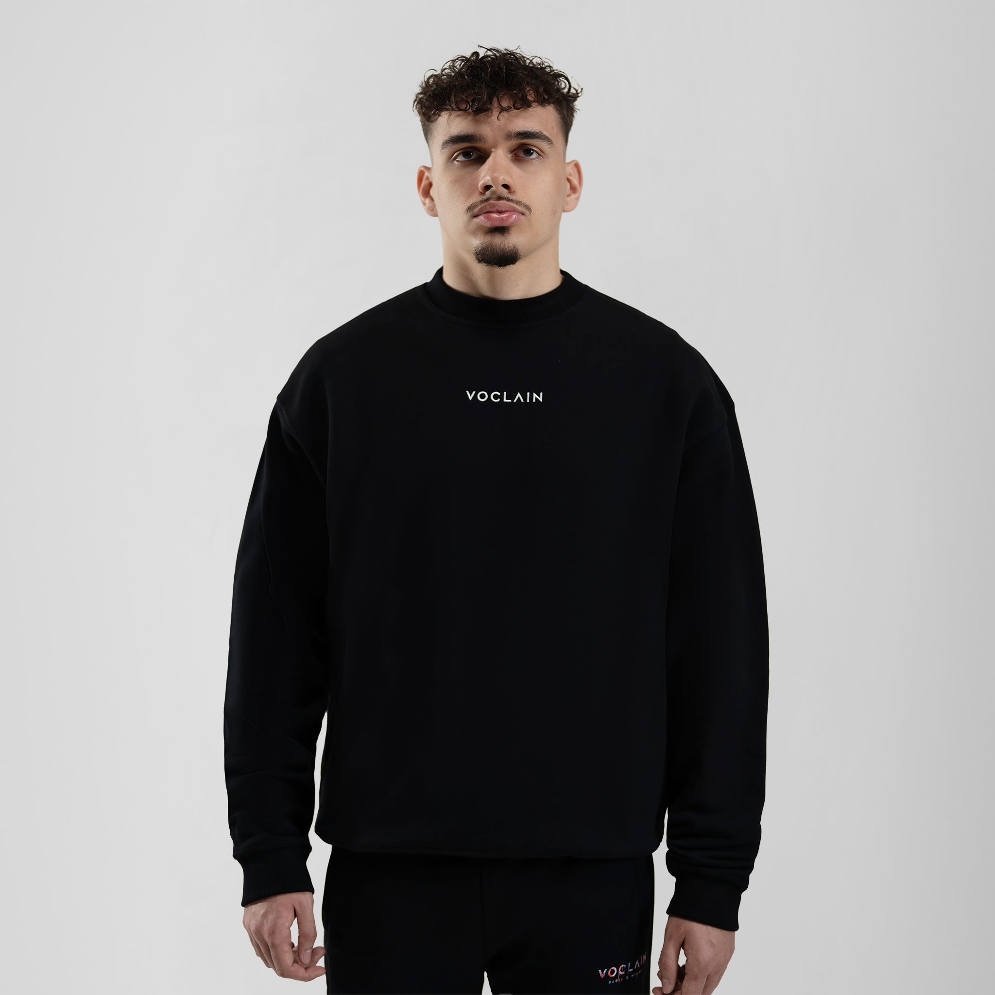 Model with Voclain Black Sweater